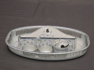 An oval Continental pierced blue and white enamelled dish 12", a wall mounting bracket 9", 2 salts and a pepper pot
