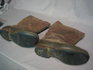 A pair of old suede flying boots