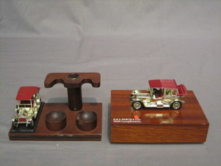 A Lesney model of a vintage motorcar mounted as a cigarette box and a similar pipe rest