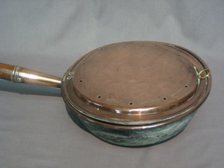 An  18th/19th  Century  copper warming  pan  with  turned  fruit wood handle