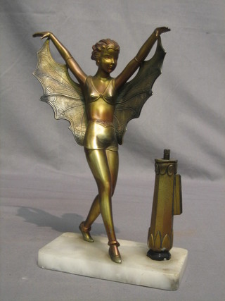 An  Art  Deco  painted  spelter  table  lighter  in  the  form  of  a standing naked lady, raised on a marble base  12"