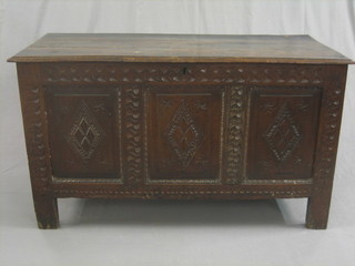 An  18th Century oak coffer of panelled construction  with  plank hinged lid (crack to lid) 47"