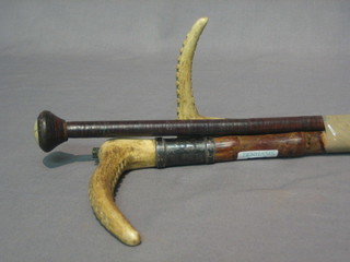 2 riding crops with stag horn handles and a whip