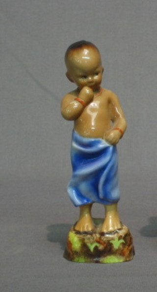 A  Royal Worcester figure, modelled by E F Doughty  -  Burman 3068,  5",  black Worcester mark to the base,  (hairline  crack  to base, feet f and r)