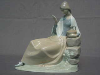 A Nao figure - Lady with Jug Reading a Letter 9"