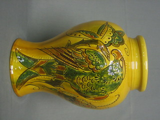 A  C H Brannam yellow glazed Art Pottery baluster  shaped  vase decorated a bird 12"