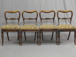 A   set  of  4  Victorian simulated  rosewood  spoon  back  dining chairs with upholstered drop in seats on turned supports
