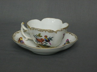 A  Dresden style coffee can and saucer decorated birds,  a  Berlin cups  and saucer, an Eastern blue and white porcelain coffee  can and  saucer  with iron replacement handle and a small  ginger  jar and cover