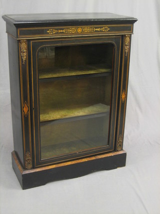 A  Victorian  ebonised  Pier cabinet with  walnut  inlay  and  gilt embellishments, raised on a platform base 30"