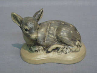 A Poole Pottery figure of a seated faun 4"