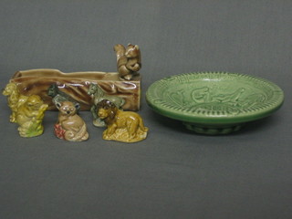 A  Wade  vase  in  the form of a tree trunk  with  squirrel  4",  a circular  Wade ashtray to commemorate the  Queen's  Coronation 5" and 6 various Wade Whimsies