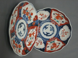 A pair of 19th Century Japanese Imari porcelain plates with lobed borders and panelled bodies 8 1/2" (1 cracked)