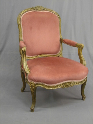 A  19th  Century  French gilt wood open arm  chair  with  carved crest