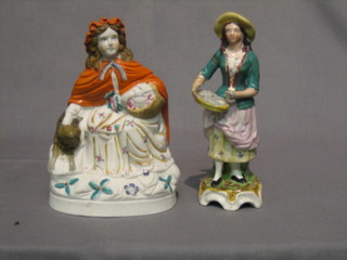 A  19th Century biscuit porcelain figure Little Red  Riding  Hood 8" and a Staffordshire figure The Oyster Seller 8" (f and r)