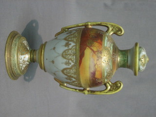 A Noritake twin handled porcelain vase, decorated a landscape 9"