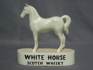 A  white pottery bar ornament for White Horse  Scotch  Whiskey 8"