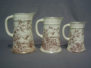 A  set  of  3 graduated 19th Century  brown  glazed  pottery  jugs