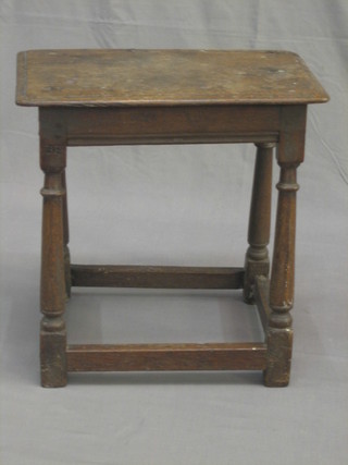 A  17th/18th  Century  rectangular oak  joyned  stool,  raised  on turned  and  block supports, the top and seat signed B  E  E,  19"  (top cracked and filled)