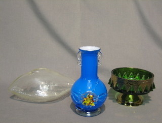 A  blue club shaped twin handled vase 8", a green glass  pedestal bowl 6" and a boat shaped glass ornament 9"