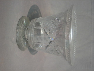 A glass trumpet shaped flower vase 8"
