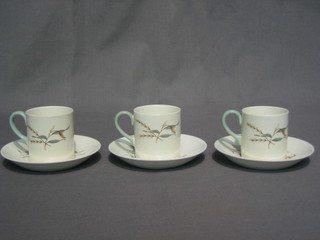 A Wedgwood 11 piece Tiger Lily pattern coffee set with 6 coffee cans and 5 saucers
