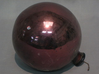 A purple glass Witches ball 5"