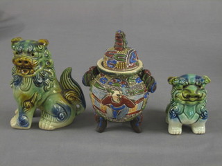 2  green  glazed  dogs of fo, 3 and 6", together with  an  urn  and cover