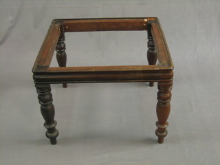 A square 19th Century mahogany stool, raised on turned supports 21"