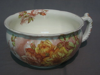 A pottery chamber pot decorated roses
