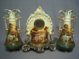 An   Edwardian  3  piece  pottery  clock  garniture  with   8   day timepiece with paper dial and Arabic numerals the case decorated shepherds  driving  sheep  and 2 matching  twin  handled  pottery vases (1 f and r)