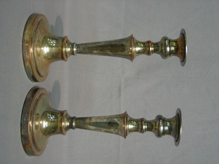 A pair of silver plated candlesticks 10 1/2"