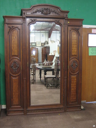 A handsome 19th Century French walnut Kingwood armoire with carved  and  shaped cornice, the centre section enclosed  by  arch shaped   bevelled  plate  mirror  door  (mirror  f)  flanked  by   2 cupboards enclosed by arch shaped panelled doors 68"