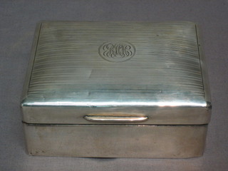A  silver  cigarette  box  with hinged  lid,  London  1924  4  1/2"