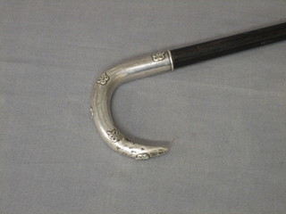A  Continental  hardwood  walking  stick  with  embossed   silver handle