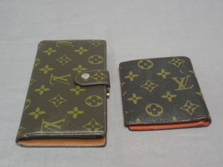 A   Louis   Vuitton   purse  complete   with   original   cardboard packaging  and  cotton  cover  together  with  a  matching  wallet