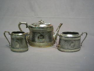 A 3 piece oval embossed Britannia metal tea service with  teapot, twin handled sugar bowl and cream jug by Walker & Hall