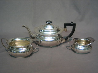 A Georgian style oval silver plated tea service comprising teapot, twin handled sugar bowl and cream jug