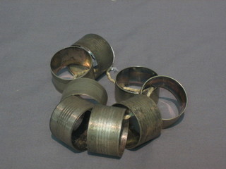 8 various silver plated napkin rings