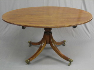 A  handsome Georgian mahogany oval snap top  breakfast  table, raised  on  column and tripods supports ending in brass  caps  and  castors 53"