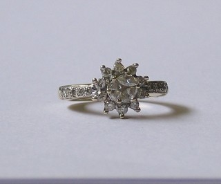 A modern 9ct gold diamond set cluster ring