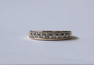 A 9ct gold half eternity ring set 8 small diamonds