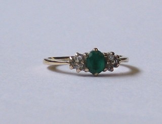 A  lady's  9ct  gold  dress  ring set  a  green  stone  and  2  small diamonds
