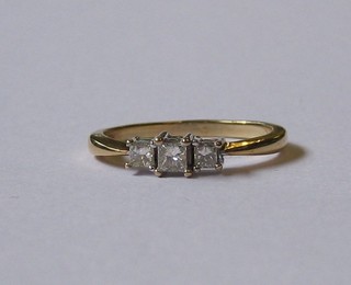 A lady's gold dress/engagement ring set 3 diamonds