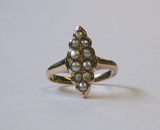 A marquise shaped gold dress ring set demi-pearls