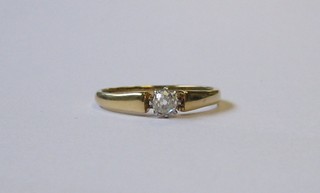 An  18ct  gold  dress/engagement  ring  set  a  solitaire   diamond