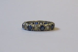 A lady's small 18ct gold eternity ring set sapphires and diamonds
