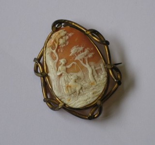A   shell   carved  cameo  brooch  decorated  a  lady with  goat contained in a gilt metal mount 2"
