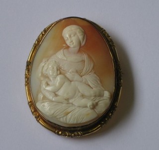 A  handsome  19th  Century   oval  shell  carved  cameo  portrait  brooch  in the form of Madonna and child contained within a  gilt metal mount 2 1/2"