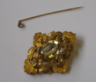 A stick pin set a diamond together with a 19th Century gilt  metal  pierced diamond shaped brooch set a yellow stone