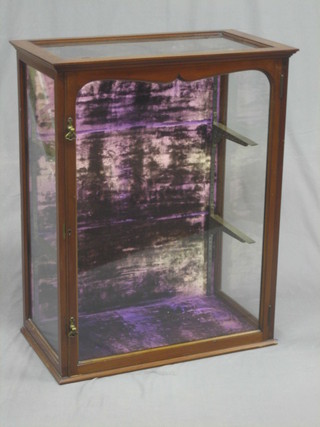 A Victorian mahogany display cabinet fitted shelves and enclosed by a glazed panelled door 29"